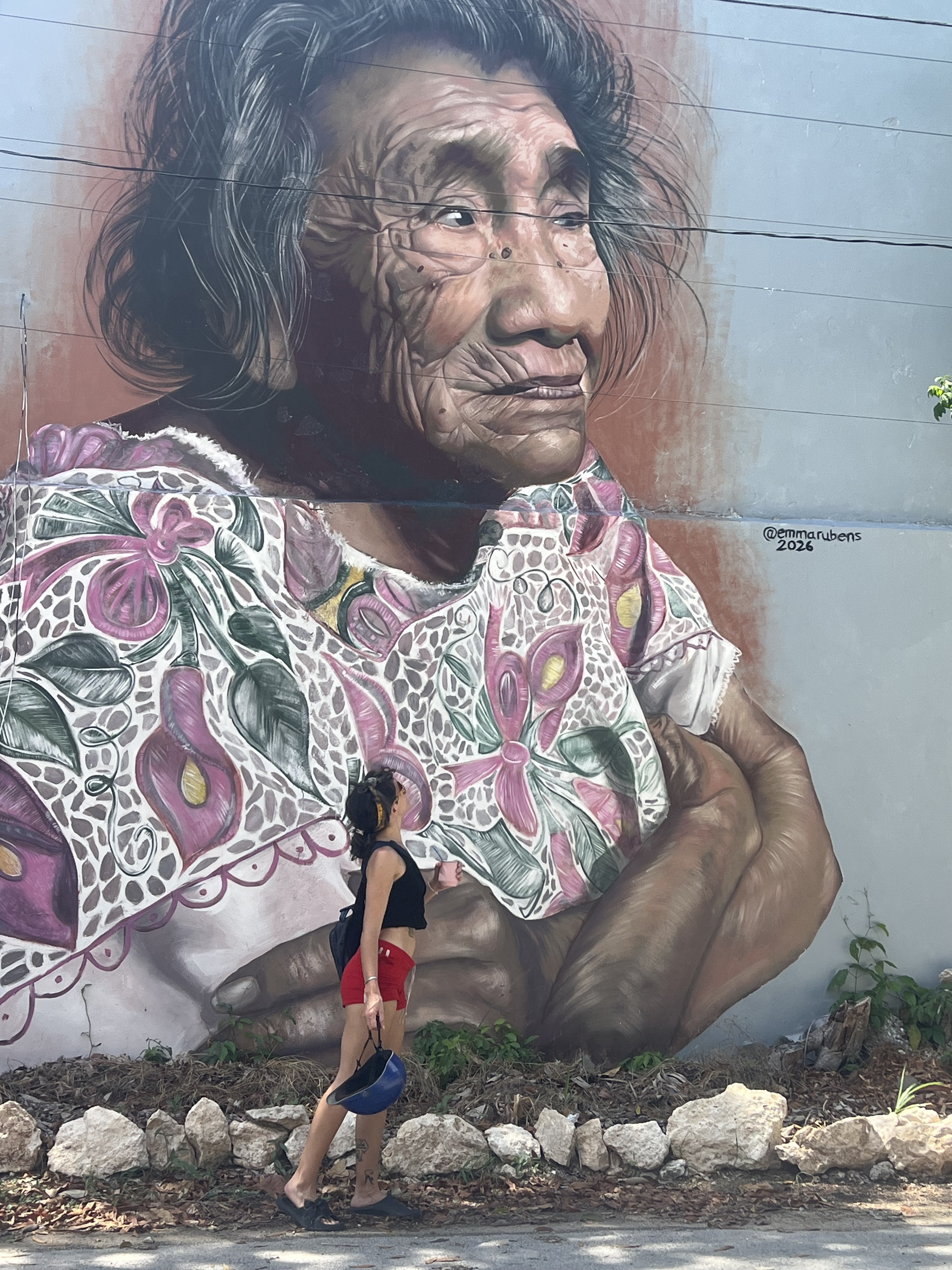 Exploring a mural on the Stories Behind the Storefronts tour in Tulum