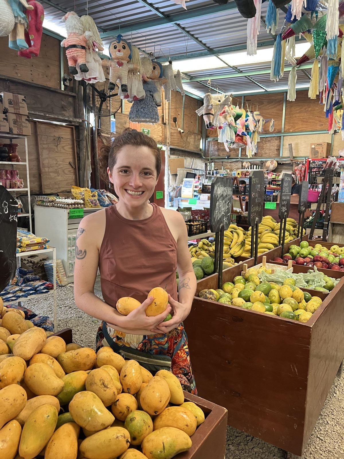 A huge pile of fresh mangoes at a local market in Tulum
